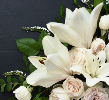 Picture of white funeral flowers.